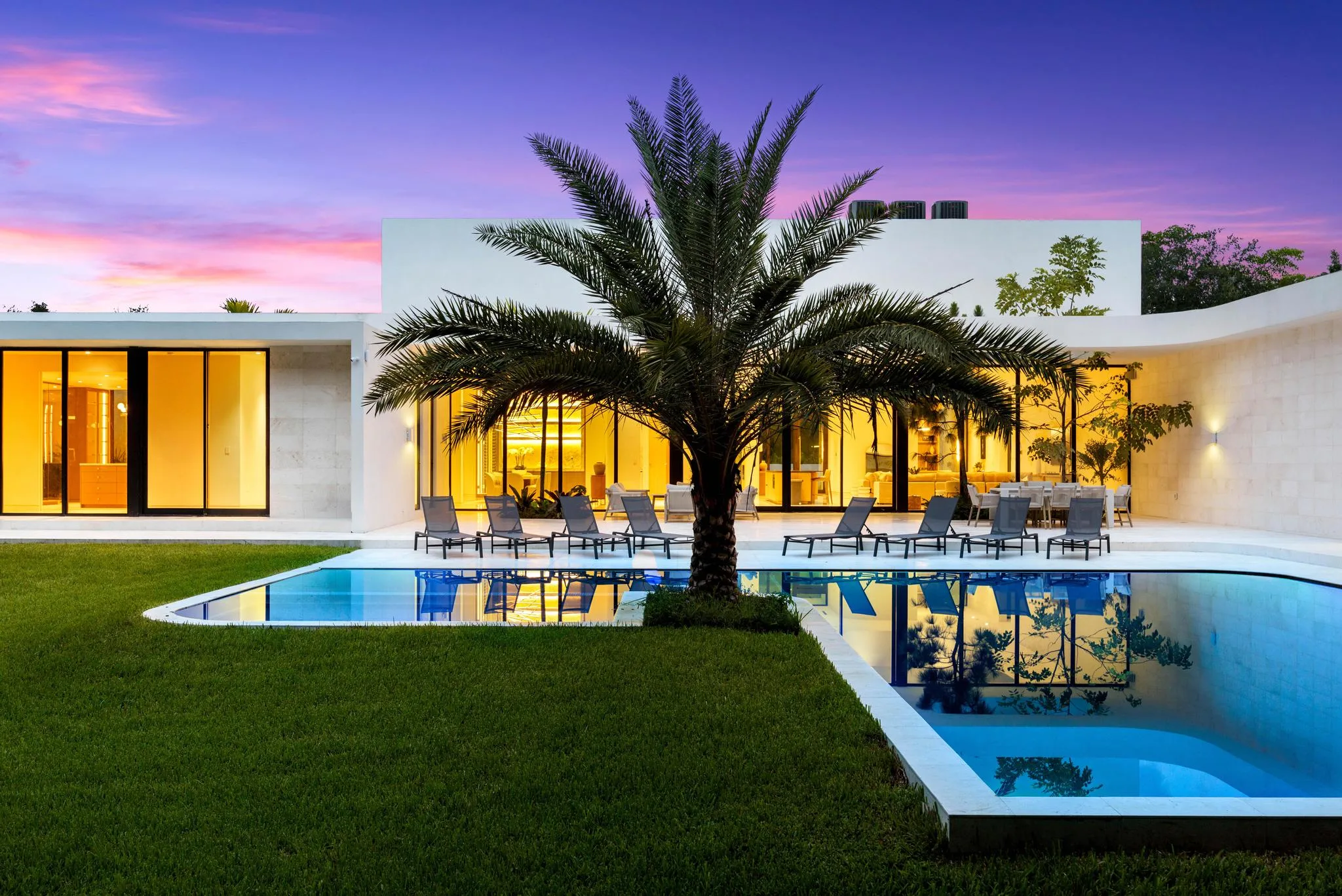 Launch venue pool and house at dusk